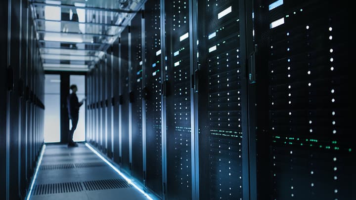 Data center with server racks and cool blue lighting